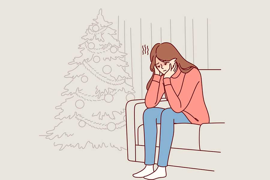 Ilustración de chica joven, pensativa en un sillón, con el árbol de navidad al fondo
