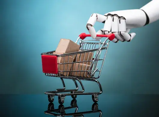 Robot sosteniendo un carrito de compras con cajas de cartón sobre fondo turquesa