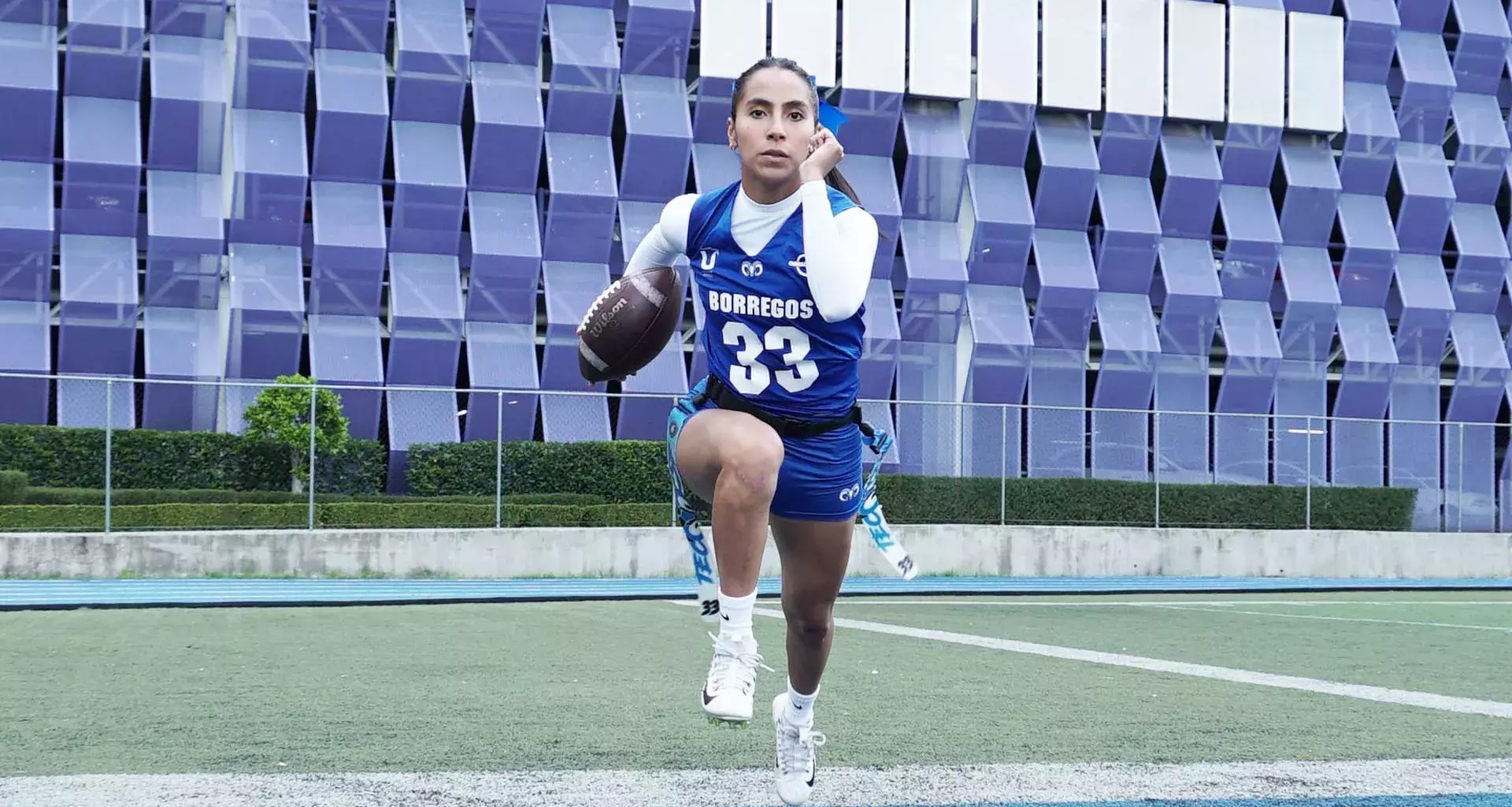 Diana Flores runs with the ovoid in a flag practice