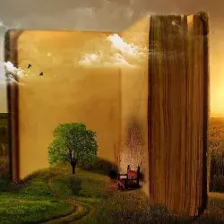 Libro gigante abierto en la cima de un valle verde.